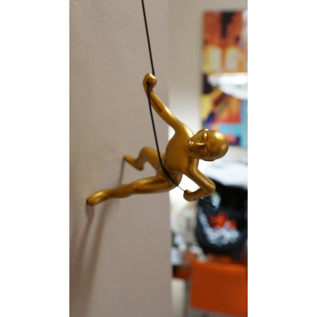 Our Luxurious Gold Climbing Man is a beautiful addition to your wall decor! Curate your own collection with our variety of...