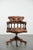 We are offering this stunning, elegant, and classic cognac-colored cowhide Chesterfield office chair/captain's chair in...