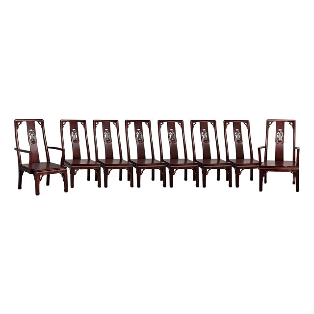 Elegant set of eight Ming style solid rosewood dining chairs. This set includes 2 host arm chairs, and 6 side chairs. Each...