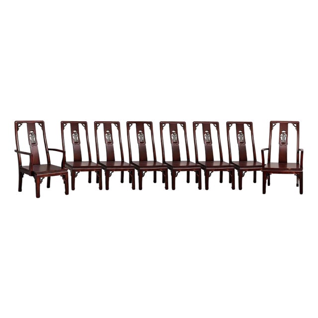 Elegant set of eight Ming style solid rosewood dining chairs. This set includes 2 host arm chairs, and 6 side chairs. Each...