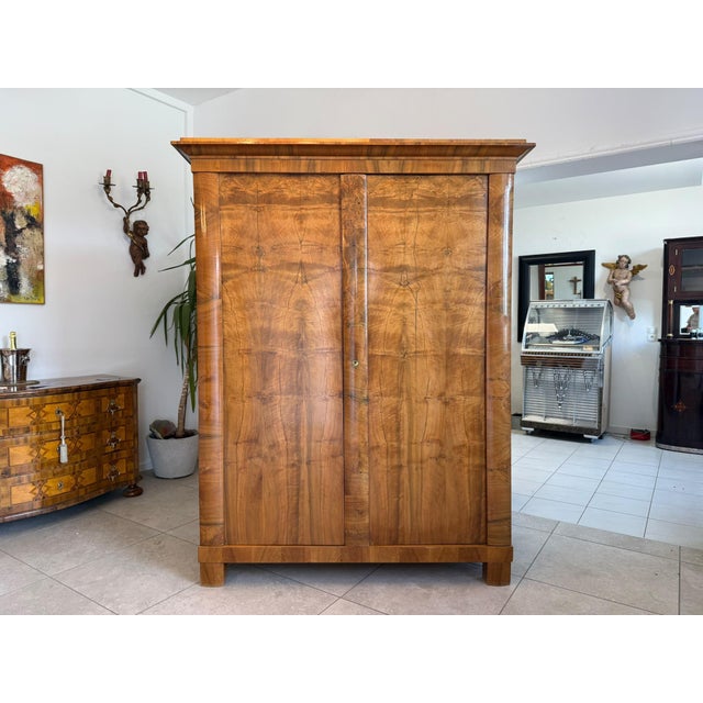 Original early 2-door Biedermeier wardrobe, circa 1840. Dimensions: Height x Width x Depth 174 x 150 x 65 cm. Original...
