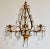 A lovely Mid 20th-Century Italian tole triple arm candle sconce with prism cut crystals. It has a decorative center...