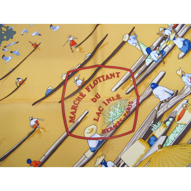 Vintage Hermes Carre 90 100% silk 'Marché Flottant du Lac Inlé' (The Floating Market of Lake Inle) scarf in vibrant red,...