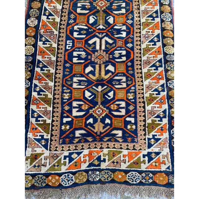 Beautiful Kazak rug with nice geometrical design and beautiful colors with orange, green, yellow, purple and blue,...