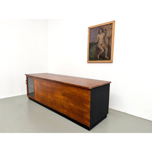Maison Lecan presents this rare piece: a large 1960s shop counter that embodies raw craftsmanship and the inherent beauty...