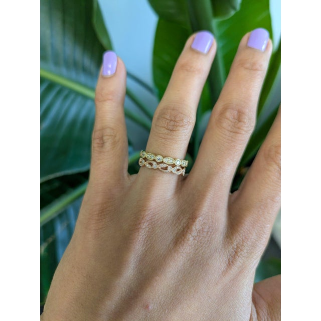 Thirty earth-mined diamonds sparkle across this solid 14K rose gold band, totalling 0.13 carats. The warm rose gold...