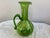 MID CENTURY BLENKO GIANT HANDBLOWN OPTIC SWIRL GREEN GLASS PITCHER WITH HAND APPLIED HANDLE. Measures 16 inches high and...