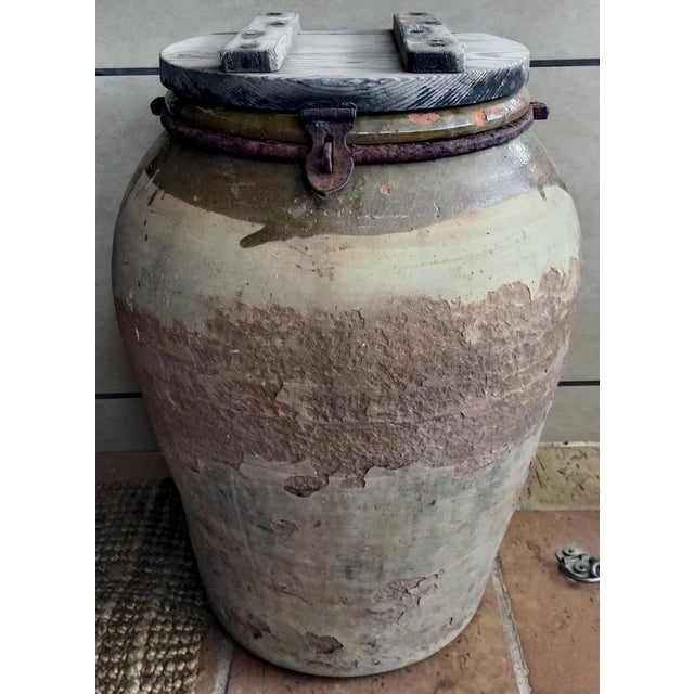 Antique earthenware jar from approximately 1880, 19th century, with its original period wooden lid. It measures 121cm in...