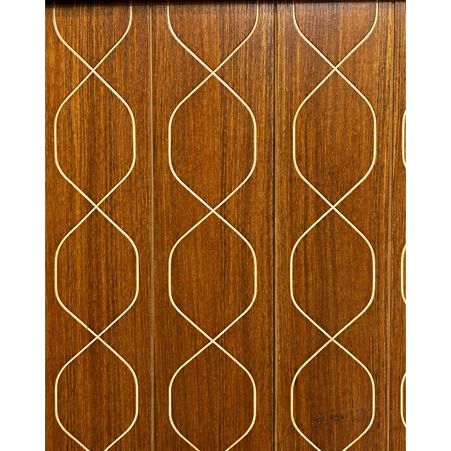 A striking example of British mid-century design, this original Gordon Russell Helix sideboard was designed by David Booth...