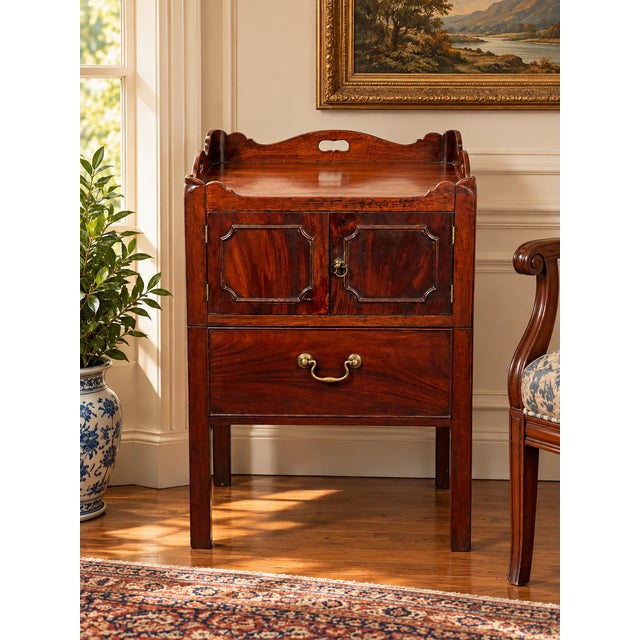 This charming late‑18th‑century George III bedside commode balances refined elegance with practical function. Originally...