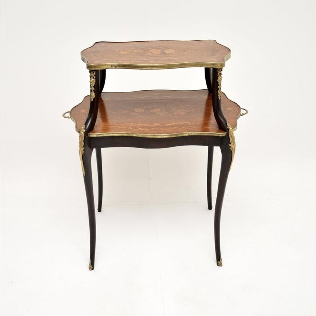 A stunning antique French inlaid walnut etagere, dating from around the 1870-1890 period. It is of extremely fine quality,...