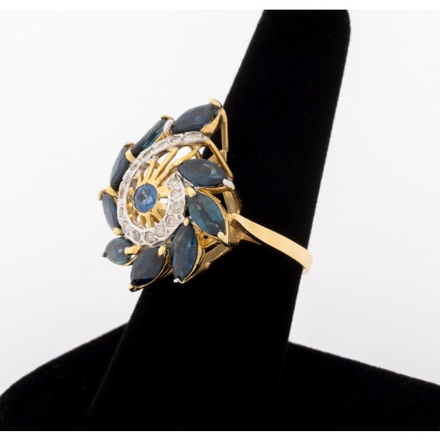 14K Yellow Gold Sapphire Diamond Ring, featuring sixteen pave set round brilliant cut diamonds weighing a total of approx....