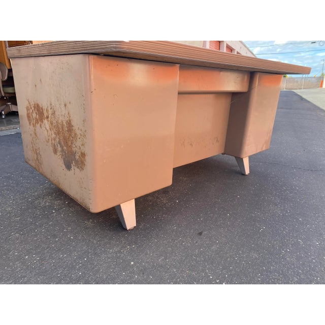 Ready for repaint or restoration good bones one side has patina nice shape vintage metal tanker desk with extra large top.