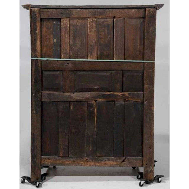possibly French, 17th/18th century, elaborately carved façade with gothic cathedral doors set with steel hinges, carved...