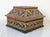 Vintage Indian dark wood trinket box with applied brass work in foliate design and copper sheet to the bullnose lid edges....