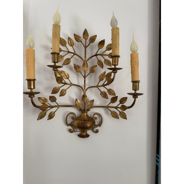 Stunning French Antique Sconces This elegant pair of gilt sconces with beautiful detailing and a wonderfully aged patina...
