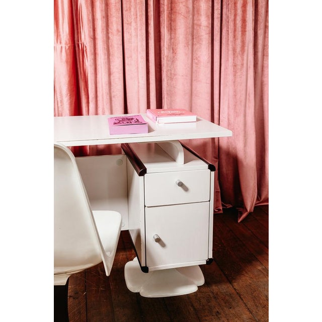 Office set comprising a cream lacquered chipboard desk with two drawers and two doors, a clover-shaped tulip base, a...