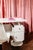Office set comprising a cream lacquered chipboard desk with two drawers and two doors, a clover-shaped tulip base, a...