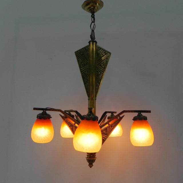Height: 90 cm. Ø: 56 cm. Dimensions caps: Height: 12 cm. Ø: 10.5 cm. Origin: France, 1930s. The lamp is equipped with 5...