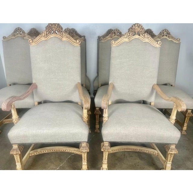 Set of Ten Italian Rococo style dining chairs with hand carved floral urn at tops of chairs. The urns are flanked by two...