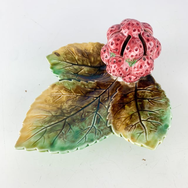 Beautiful vintage pottery dish with leaves and strawberries - raspberries. Lovely textures and colors. Writing on back -...