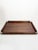 An elegant wooden tray dating from the 1950s, characterized by its clean lines and subtly rounded edge. Its minimalist...