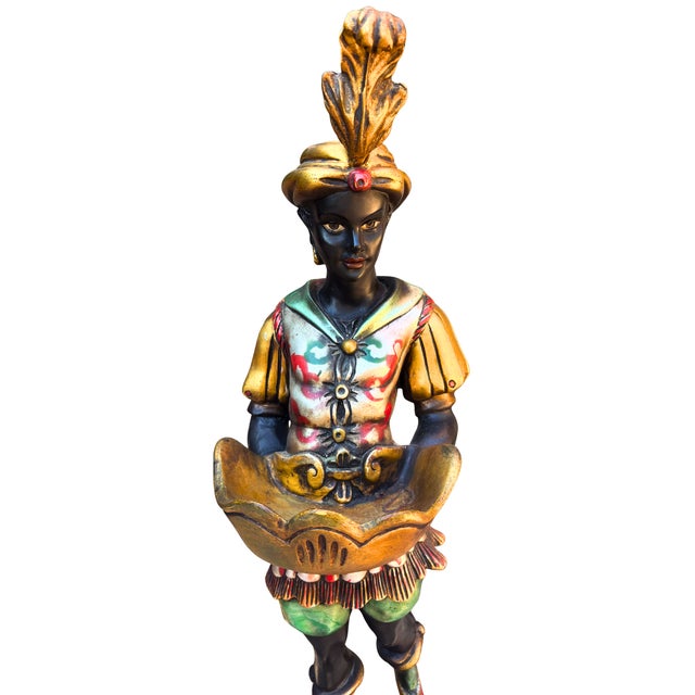 A striking and unusually large venetian-style blackamoor figure, beautifully rendered in rich polychrome colors with gilt...