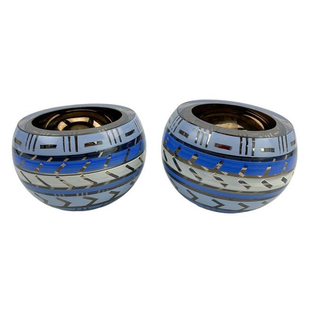 A pair of 20th century Sweden hand painted art glass tea light holders from the "Tonga Line " by Monica Backstrom...