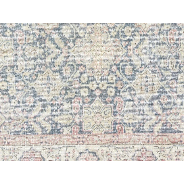 This Vintage Turkish Oushak Rug adds a vibrant touch to any home with its combination of wool and cotton. Measuring 7' x...