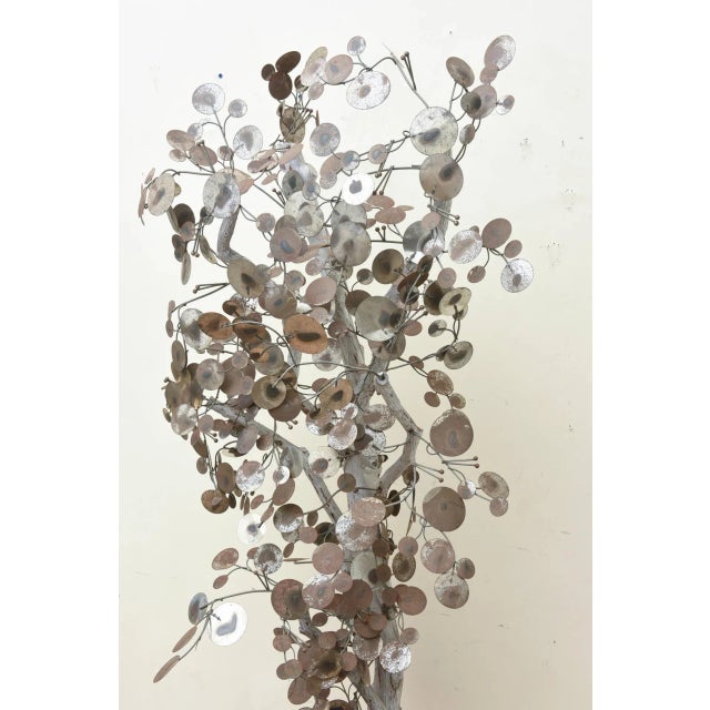 This patinated multi metal disk vintage Curtis Jere life size raindrop tree sculpture is weathered. The faux soil that is...
