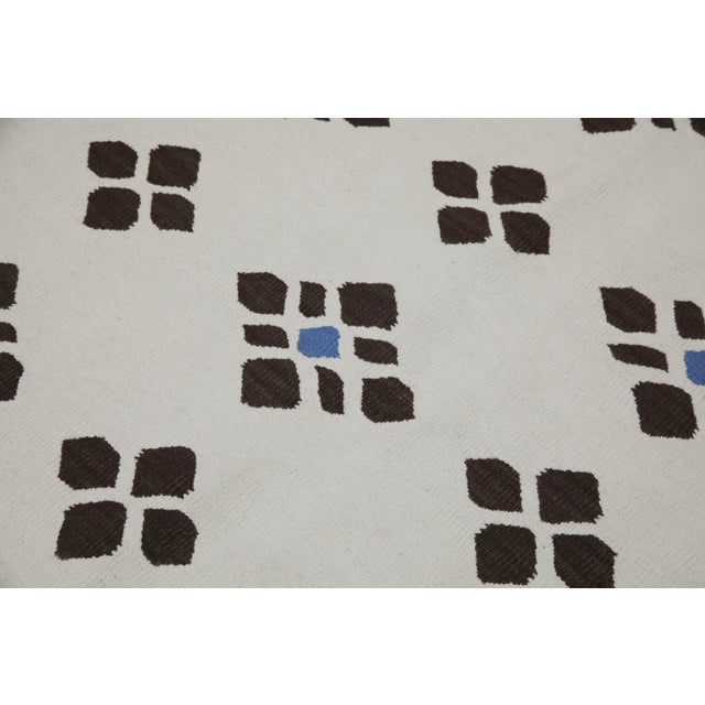 This exquisite Turkish flatweave kilim rug is a stunning masterpiece of traditional craftsmanship. Each rug is...