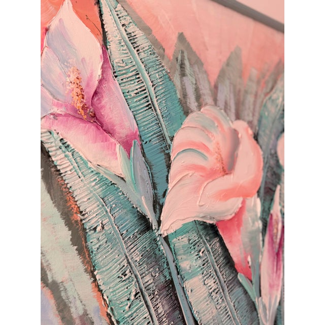 This still life painting depicts three prominent calla lilies with soft white petals brushed with blush pink, surrounded...