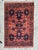 Beautiful Afghan rug from the late 20th century, entirely hand-knotted in wool on a wool foundation. It features stylized...
