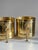 This impressive pair of vintage brass lion head planters exemplifies the bold elegance of Hollywood Regency design....