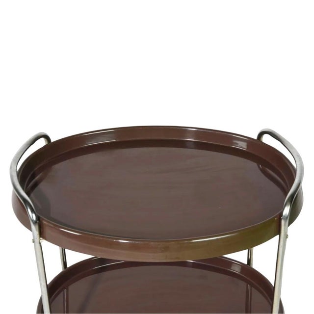 Vintage Italian Space Age bar cart dating to the 1970s, constructed with two chocolate-brown molded ABS trays and a...