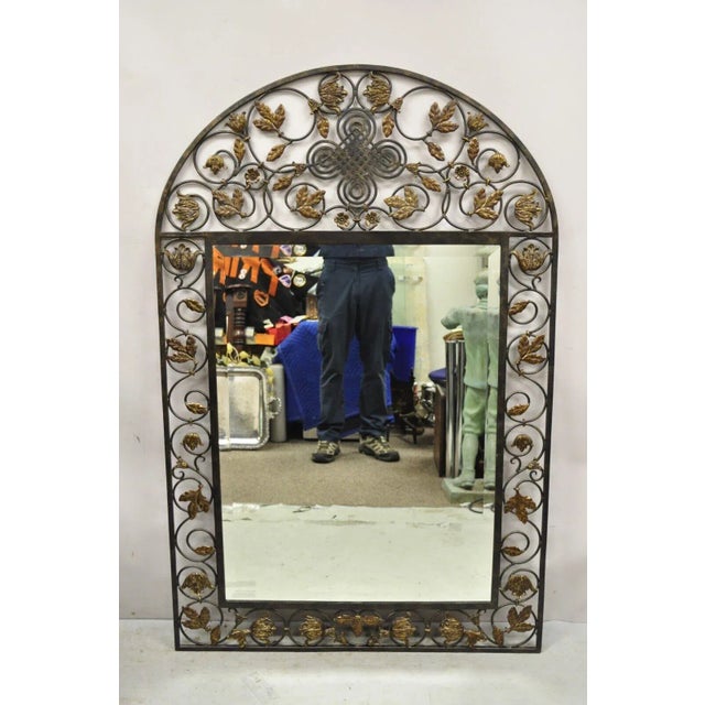 LaBarge Mediterranean Style Wrought Iron Flower Leaf Scroll Wall Mirror. Circa Late 20th Century. Measurements: 57" H x...