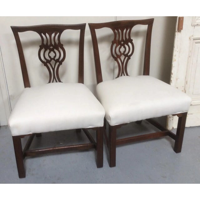 Great looking wide comfortable side chairs with open carved backs and warm antique patina. Older restoration to the back...