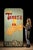 Vintage painted carnival sideshow sign advertising “Tiny Teresa,” a purported six-inch-tall performer shown alongside a...
