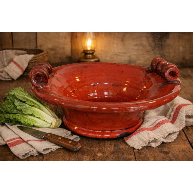 Bring warm Tuscan character to your table or kitchen with this striking large Italian terracotta bowl attributed to...