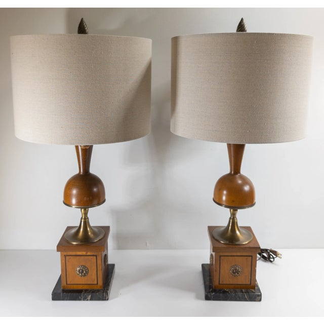 We are selling this great looking pair of Table Lamps. This table lamp features unique oak and brass decoration and shape...