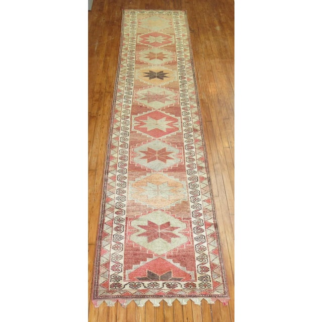 One of a kind, mid 20th-century Hand-knotted Turkish Anatolian geometric runner tad under 14 feet long. Professionally...