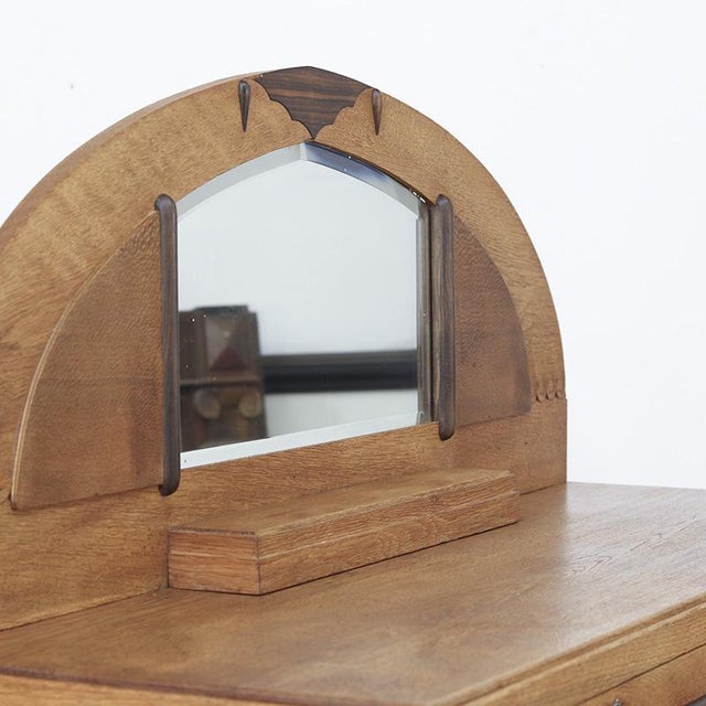 Art Deco oak sideboard with faceted mirror and coromandel wood accents. The cabinet is largely made of solid oak, with the...
