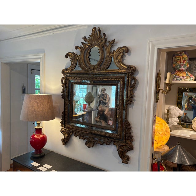 18th Century Italian Baroque Giltwood Mirror. Offered is a stunning 18th century gilt wood mirror from the 18th century....