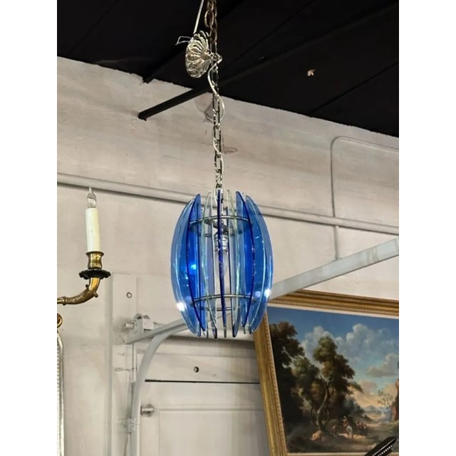 Vintage Murano pendant light. Circa 1970. The chandelier has been professionally rewired, comes with matching chain and...