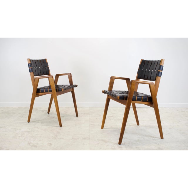 Mel Smilow leather woven strap and walnut framed dining chairs (attributed w/no makers mark). Two arm chairs and four side...