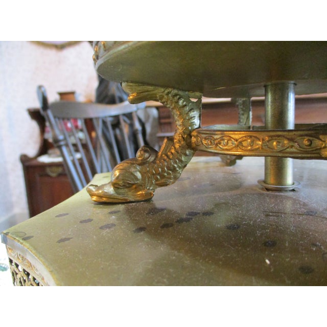 The product is an antique Moser Bohemian Czech lamp mantle featuring a green enamel design with serpent feet. This piece...