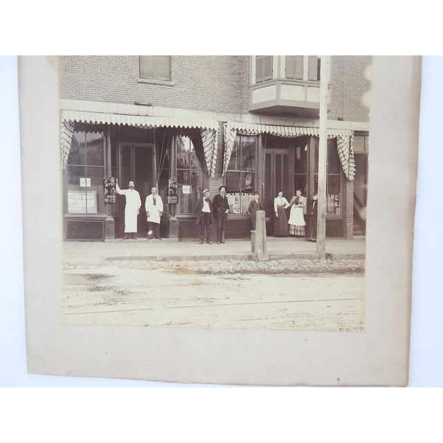 Late 19th century sepia tone albumen photograph of an Oyster House. Brick building with canvas awnings, AL Stevens Oyster...