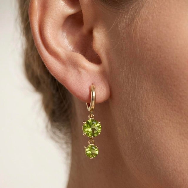 Bring a vibrant splash of nature’s finest color to your jewelry collection with these exquisite double-drop huggie...