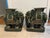 A pair of Emerald Green glazed terra cotta Elephant Garden Seats with gold accents and raised Chinese letters standing on...