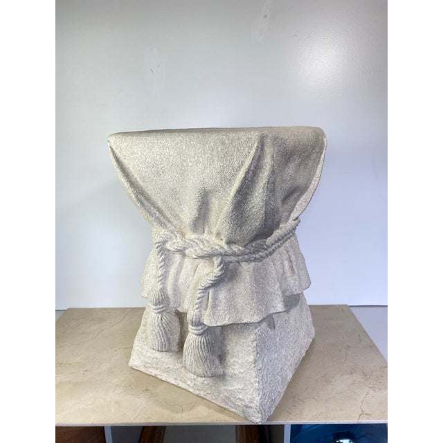 A striking trompe l'oeil plaster side table in the manner of John Dickinson, sculpted to resemble a square pedestal draped...
